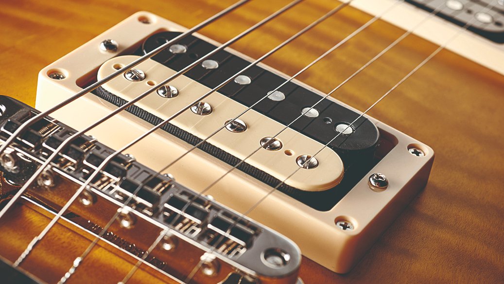 Close-up of electric guitar pickups showing technical detail